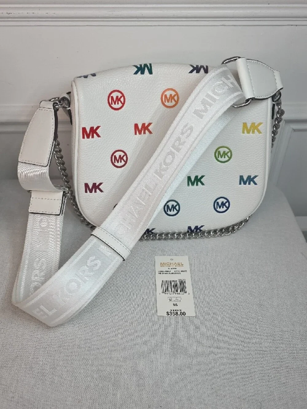 Michael Kors Slater Medium Rainbow Logo Embossed Sling Pack in Optic White